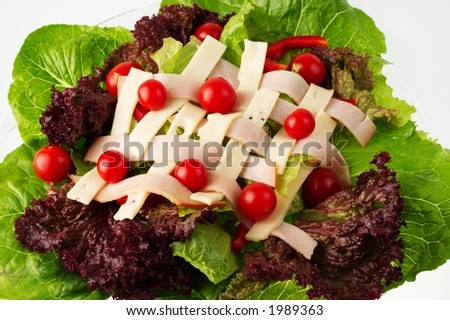 A delicious Chef\'s Salad with fresh Romaine and  Red Leaf lettuce, Red Pepper, Cherry Tomatoes, Thin Sliced Turkey, and Swiss Cheese.