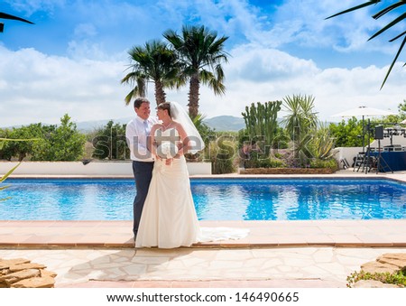 Bride and Groom at the reception pool side after  their Wedding Reception