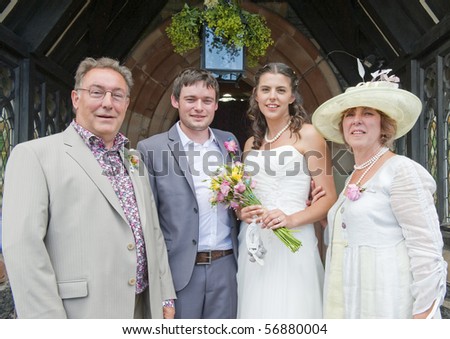 Bride and Groom with her Parents at Church Door