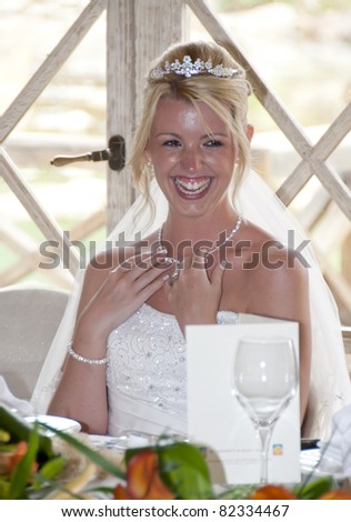 Bride laughing at the reception