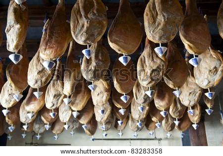 Serrano Ham hanging in a shop in the Alpujarra Mountains, Granada Province, Andalusia, Spain