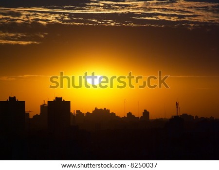 Sunset between the clouds and the City