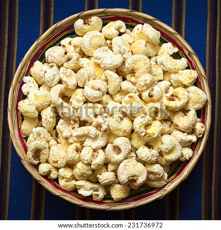 Sweetened popped white corn called Pasancalla eaten as snack in Bolivia served in a woven basket, photographed with natural light