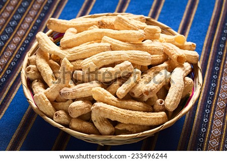 Sweetened popped pasta eaten as snack in Bolivia served in woven basket, , photographed with natural light (Selective Focus, Focus in the middle of the snack)
