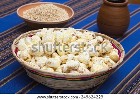 Sweetened popped white corn called Pasancalla eaten as snack in Bolivia served in a woven basket, photographed with natural light (Selective Focus, Focus in the middle of the snack)