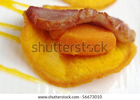 Appetizer: A slice of ham on mashed sweet potato and sweet potato chip (Very Shallow Depth of Field)
