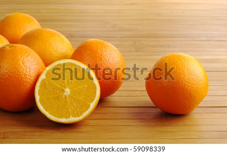 Oranges on wooden table mat (Selective Focus)