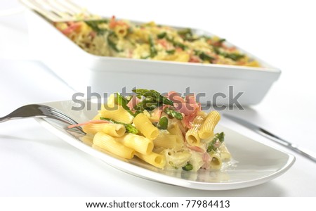 Green asparagus, ham and pasta casserole (Selective Focus, Focus on the front of the food on the plate)