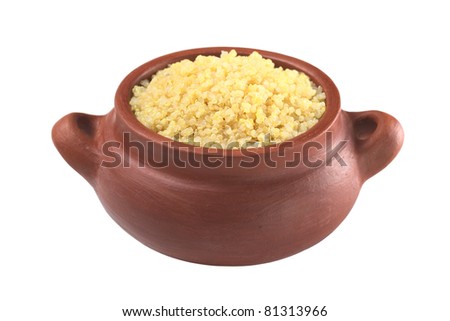 Cooked white quinoa in rustic bowl which can be eaten as a side dish like rice and is rich in proteins isolated on white (Selective Focus, Focus on the front of the quinoa)