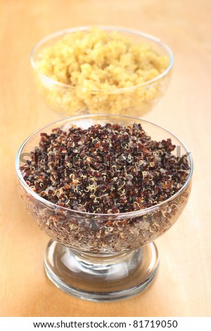 Cooked red and white quinoa in glass bowls which can be eaten as a side dish like rice and is rich in proteins (Selective Focus, Focus on the red quinoa)