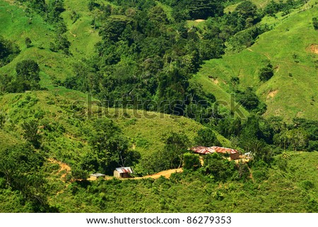 Small hut on the lush green slopes of the North Colombian Sierra Nevada close to Santa Marta