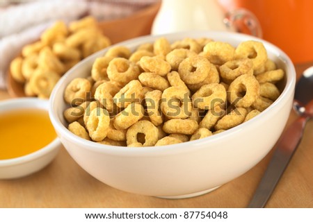 A bowl full of honey flavored cereal loops (Selective Focus, Focus one third into the bowl)