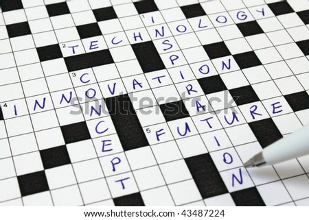 Concept Innovation Technology Inspiration Future Crossword close up and pen