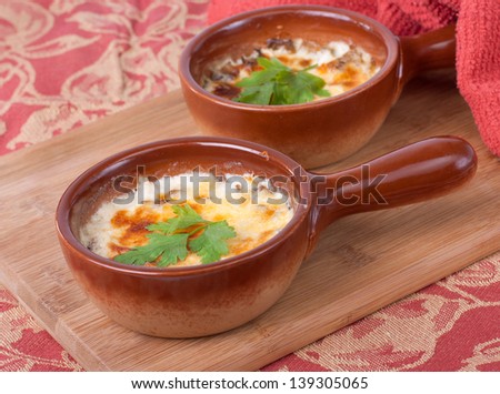 mushrooms  baked with cheese (julienne in Russian cuisine)