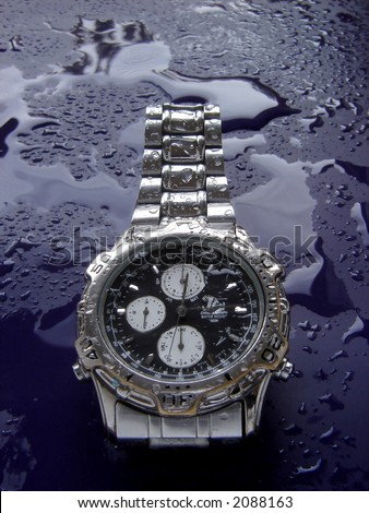 Water resistant high tech watch splashed with water drops