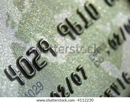 Credit card macro shot. Focus on serial numbers. Very high-tech.