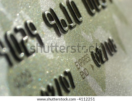 Credit card macro shot. Focus on part of a serial number and a label \
