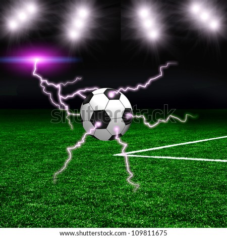 Soccer ball on the green field with lightnings