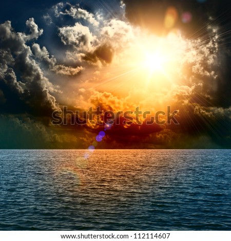 Yellow Sun Set In The Middle Of The Ocean