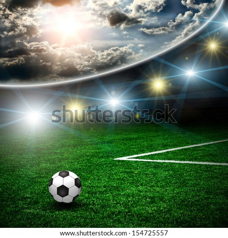 Soccer ball on the green field and lightning