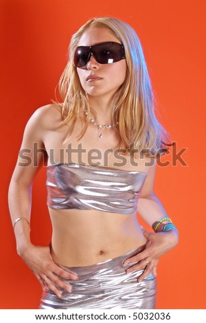 stock photo beautyfull latin girl posing in sylver dress and sun glasses
