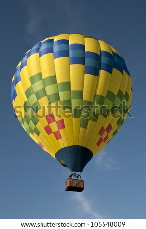 Beautiful hot air balloon flying against a blue sky