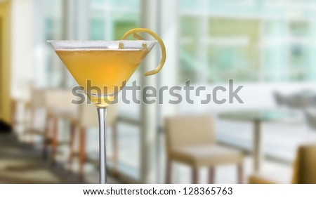 Martini closeup with interior in the background with window seating