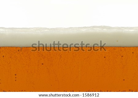 side view of large container of beer,show bubbles and nice foam on top