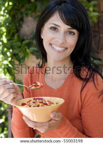 beautiful happy smiling woman have breakfast on her home patio