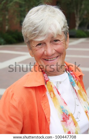 Smiling attractive lady, age 70.