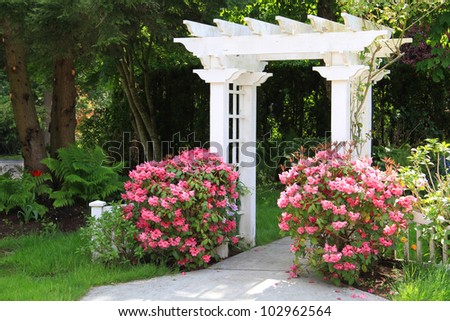 Pretty garden arbor with pink flowers. Also available in vertical.