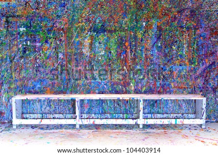 Paint splattered wall in an art studio, also available in vertical.