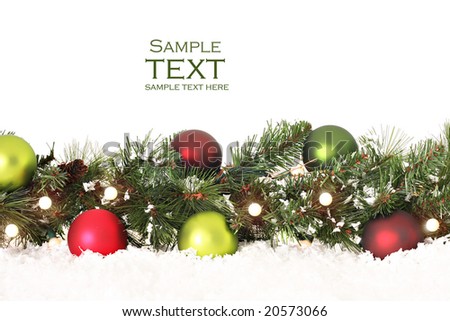 Christmas border of evergreen ornaments lights and snow Christmas border of evergreen ornaments lights and snow