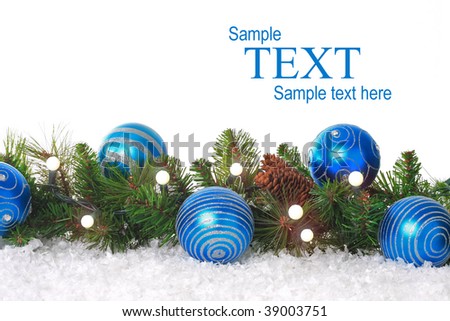 Christmas border with lights, blue ornaments and snow. Add your own text.