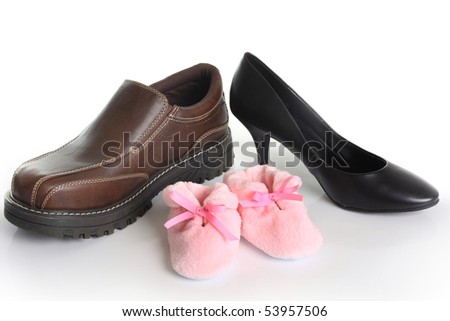 Parents shoes with pink booties. Also available with blue booties. Birth announcement concept.