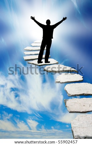 Male silhouette on a stone pathway leading to heaven