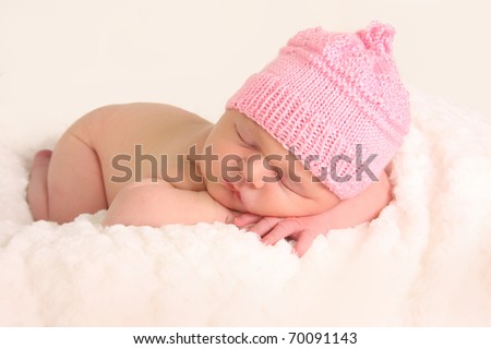 Newborn baby girl in a knitted hat Newborn baby girl in a knitted hat