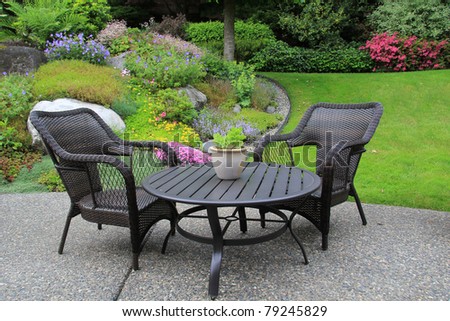 Patio furniture in a beautiful garden.