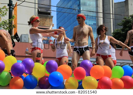 VANCOUVER BRITISH COLUMBIA, CANADA - JULY 31: Colorfully dressed participants during the annual gay pride parade on July 31 2011 in Vancouver, B.C. Canada.