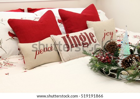 Christmas bedroom with holiday cushions.