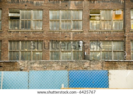 factory windows and wire fence