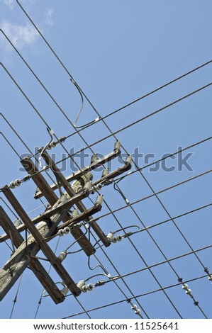grid of power lines on pole
