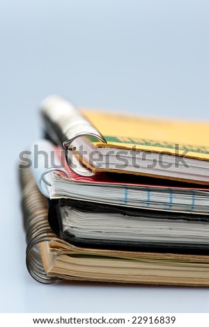 stack of ring bound notebooks