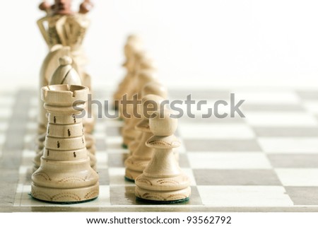 White chess figures on chess desk
