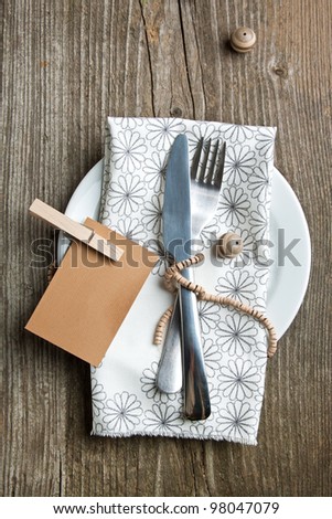 Rustic table setting on old wooden table with wooden decor