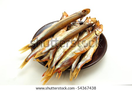image brown saucer with fish capelin cold  smoked