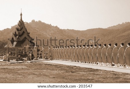 Statues of Monks lining up to pray to the Buddha