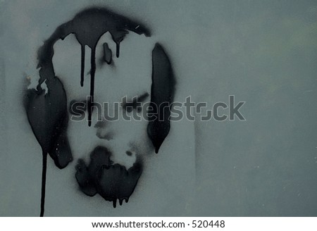 A face spray painted on sheet metal
