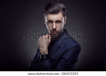 Handsome young man in stylish jacket. Office worker. Successful businessman