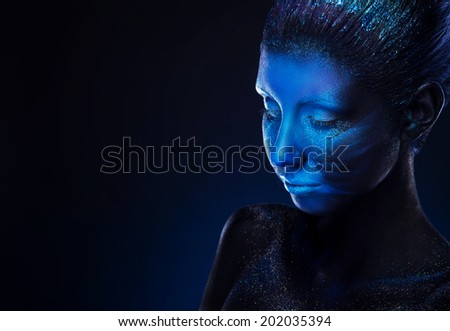 Beautiful woman with modern face art. Deep blue colour